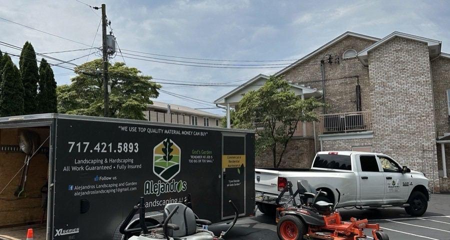 Alejandro's Landscaping trailer and equipment on a job